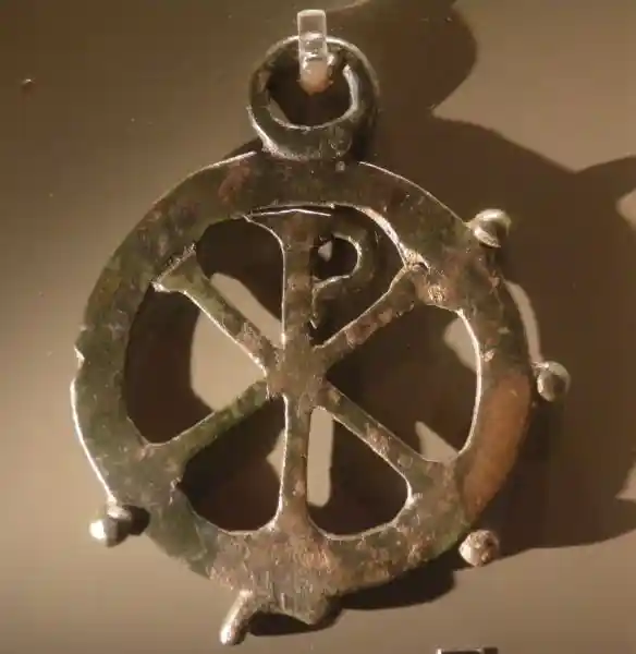 Chiro on a metal pendant